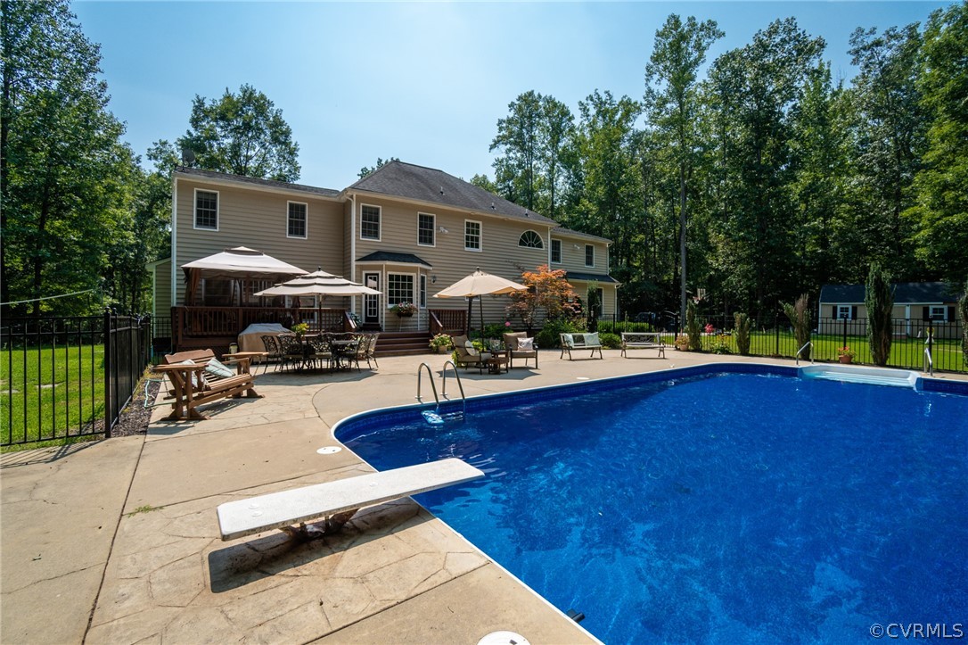 11518 Winterpock Road Chesterfield, VA 23838 - Photo 46 of 48 a front view of a house with swimming pool garden and patio