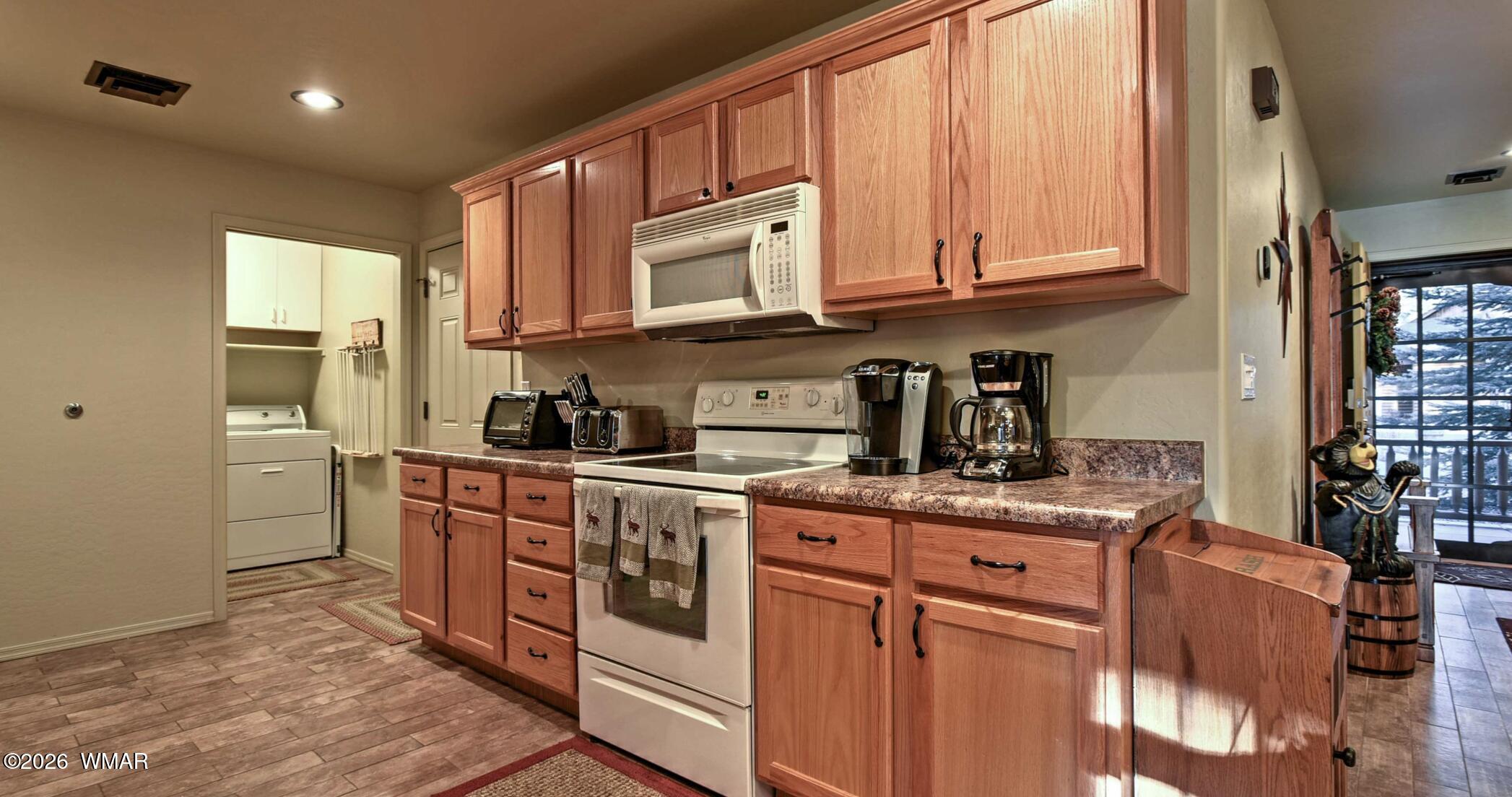 2942 Timber Line Road Pinetop, AZ 85935 - Photo 11 of 27 a kitchen with stainless steel appliances granite countertop a sink stove and cabinets