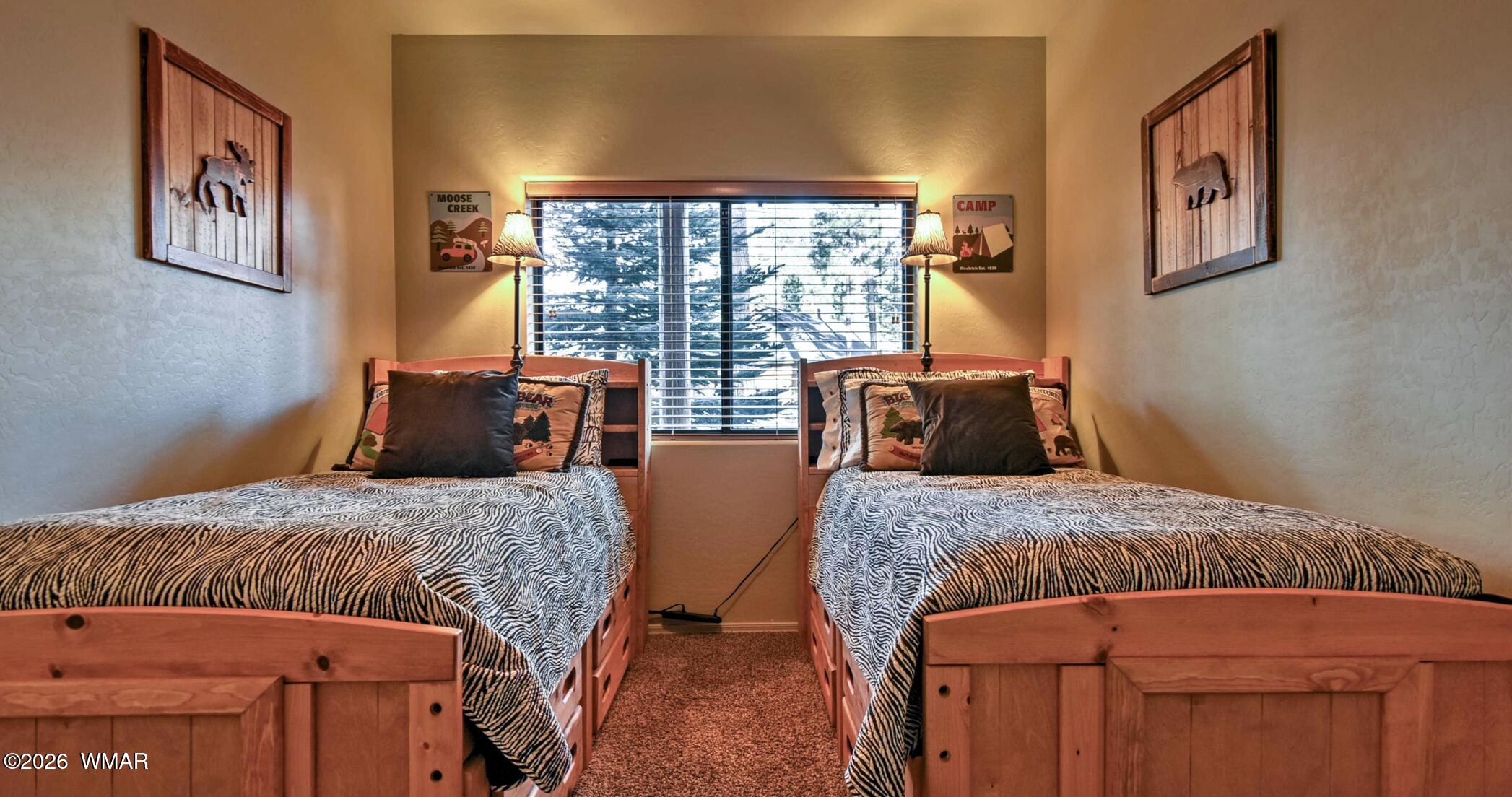 2942 Timber Line Road Pinetop, AZ 85935 - Photo 16 of 27 a bedroom with two beds and wooden floor
