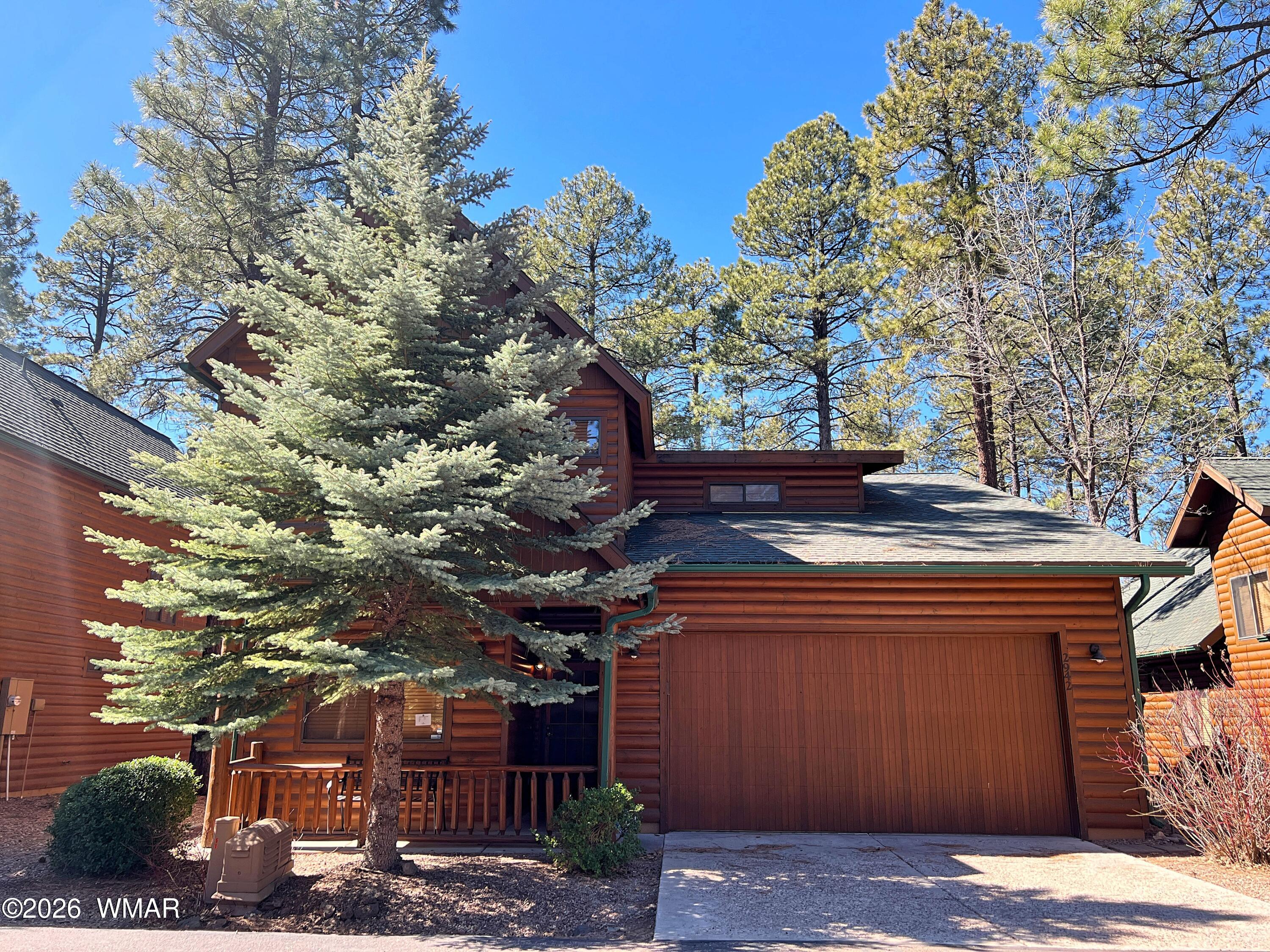 2942 Timber Line Road Pinetop, AZ 85935 - Photo 2 of 27 a front view of a house with trees