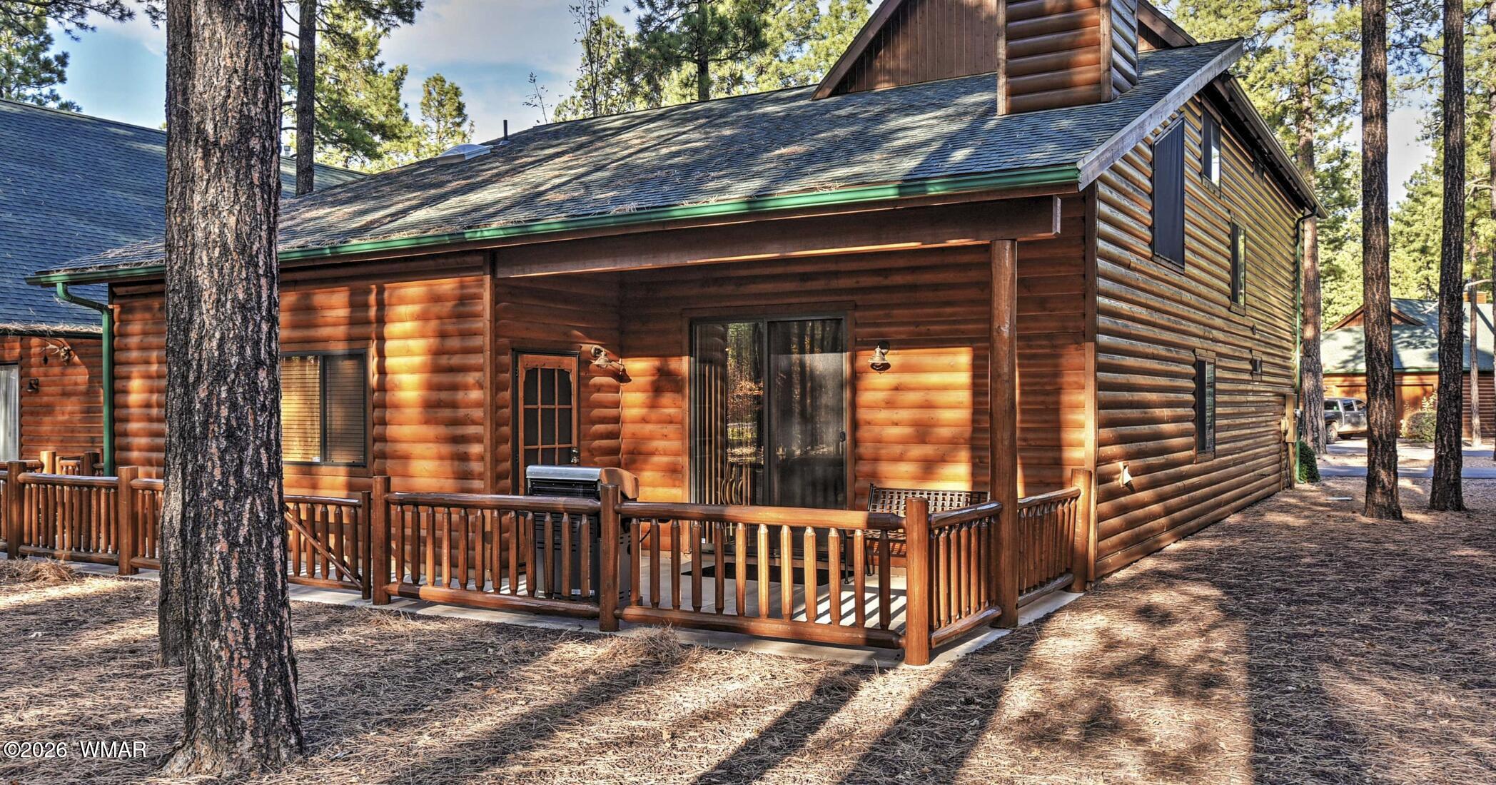 2942 Timber Line Road Pinetop, AZ 85935 - Photo 25 of 27 a view of a house with a wooden fence