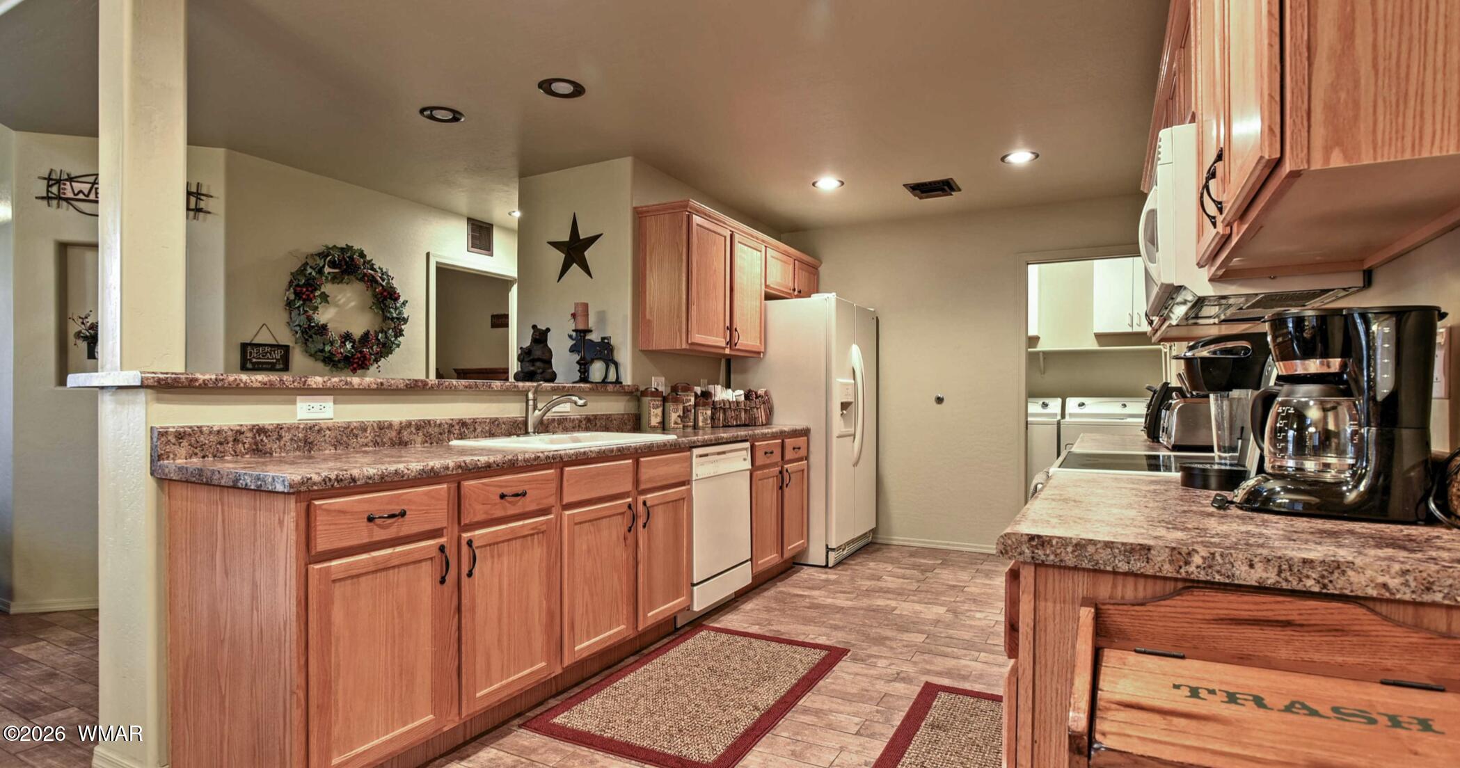2942 Timber Line Road Pinetop, AZ 85935 - Photo 10 of 27 a bathroom with a granite countertop sink and a mirror