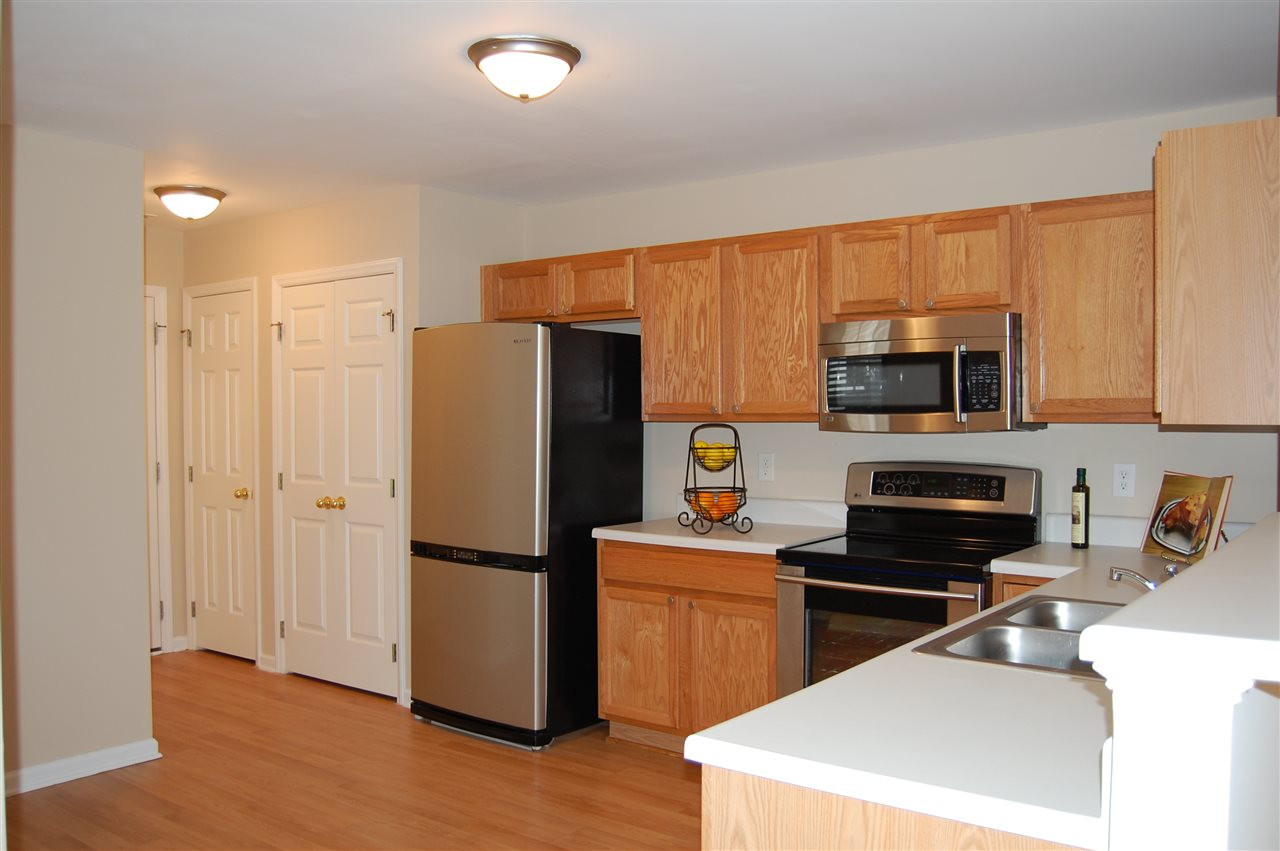 116 Student Place Durham, NC 27713 - Photo 3 of 14 Eat -in Kitchen with Laminate floors and stainless appliances. Kitchen