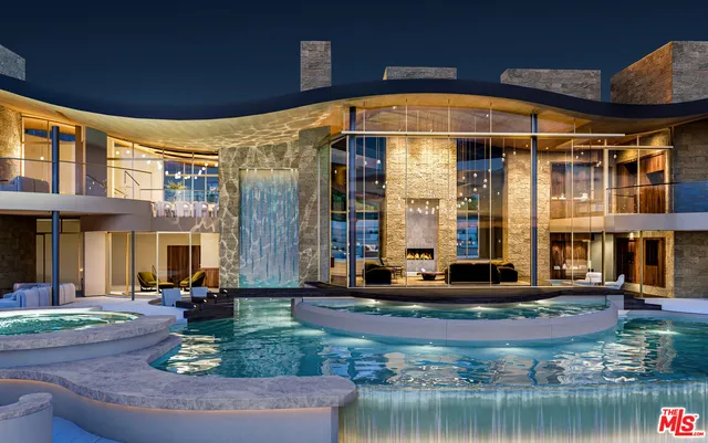 a front view of a building with swimming pool