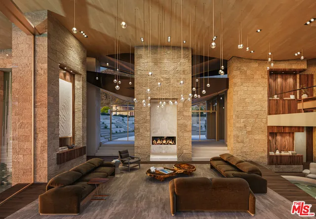 a living room with couches and kitchen view