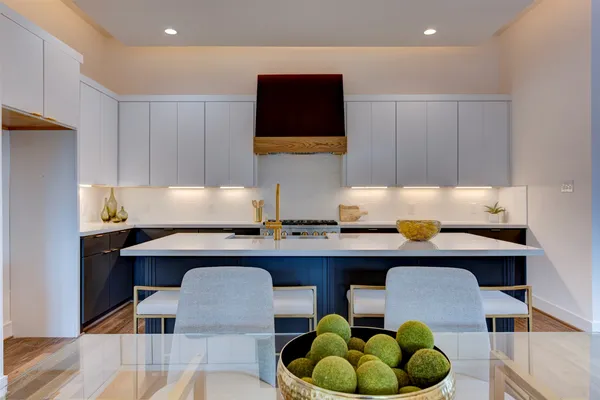 a kitchen with a sink cabinets and window