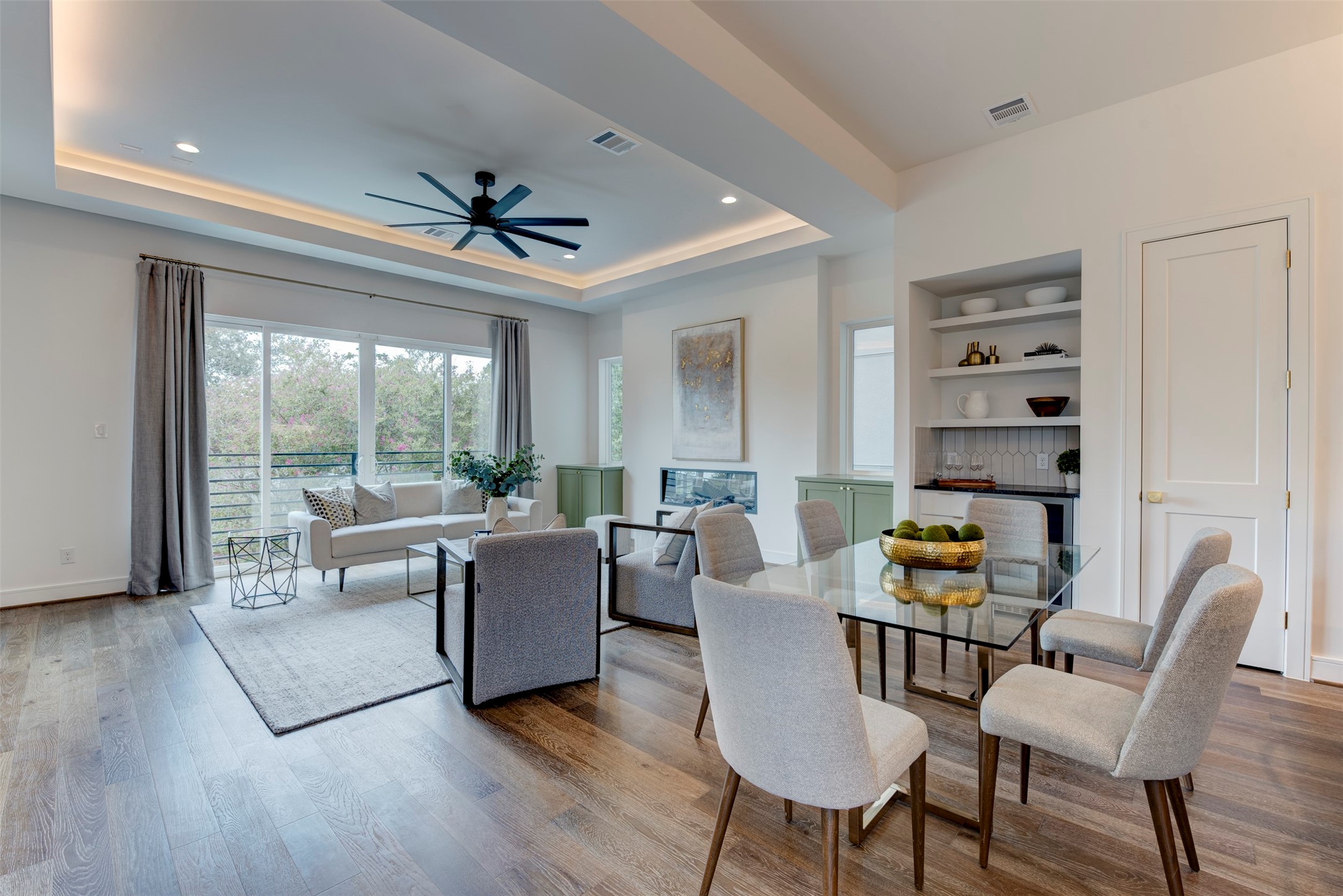 7120 Gary Street, Unit B Houston, TX 77055 - Photo 14 of 29 Tons of natural light floods the space, thanks to the balcony and expansive windows, creating a bright and inviting atmosphere.