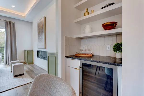 a kitchen with stainless steel appliances granite countertop a stove and a refrigerator
