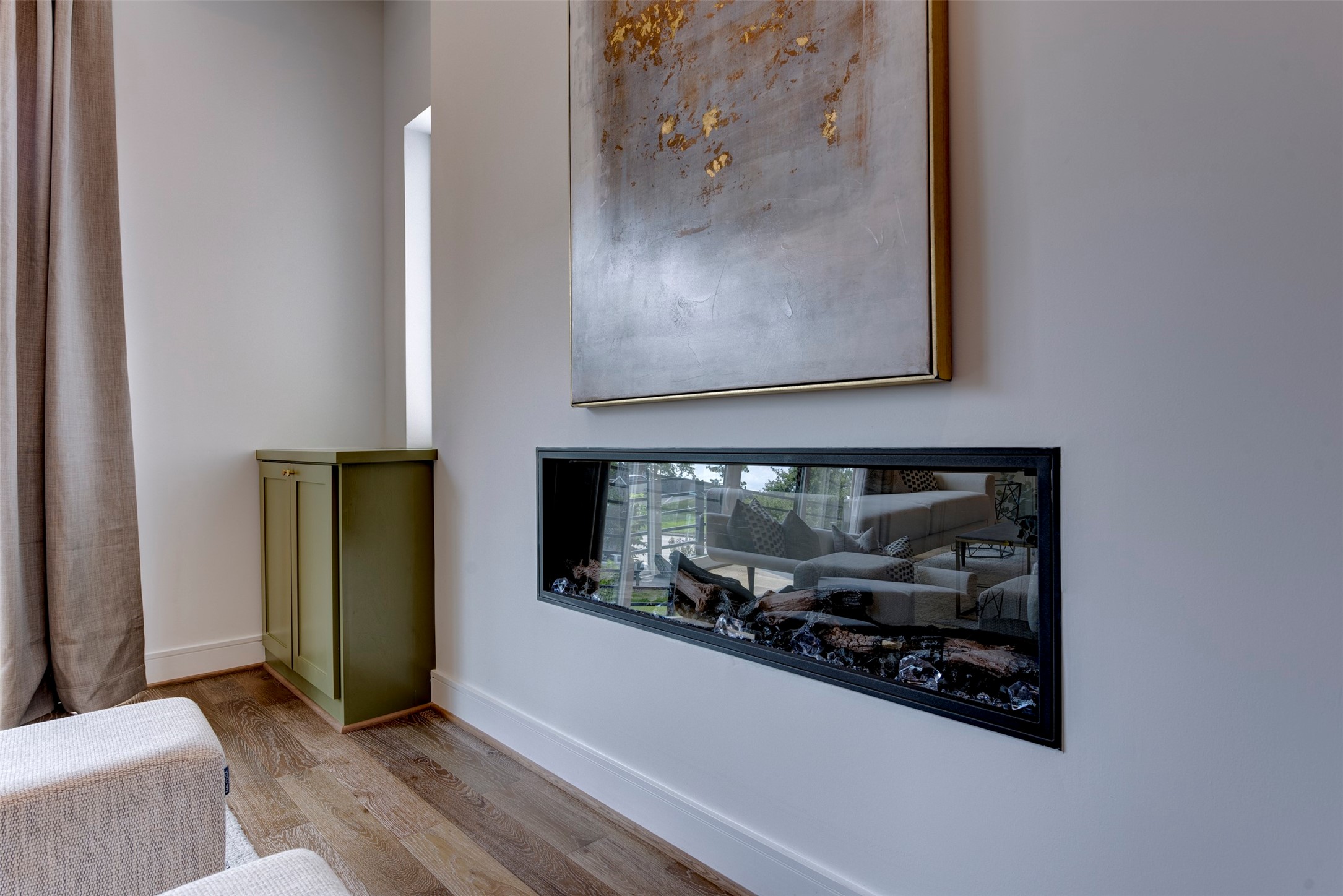 7120 Gary Street, Unit B Houston, TX 77055 - Photo 17 of 29 Built-in electric fireplace. This feature adds warmth and style to the home, making it an attractive and modern amenity for potential buyers.