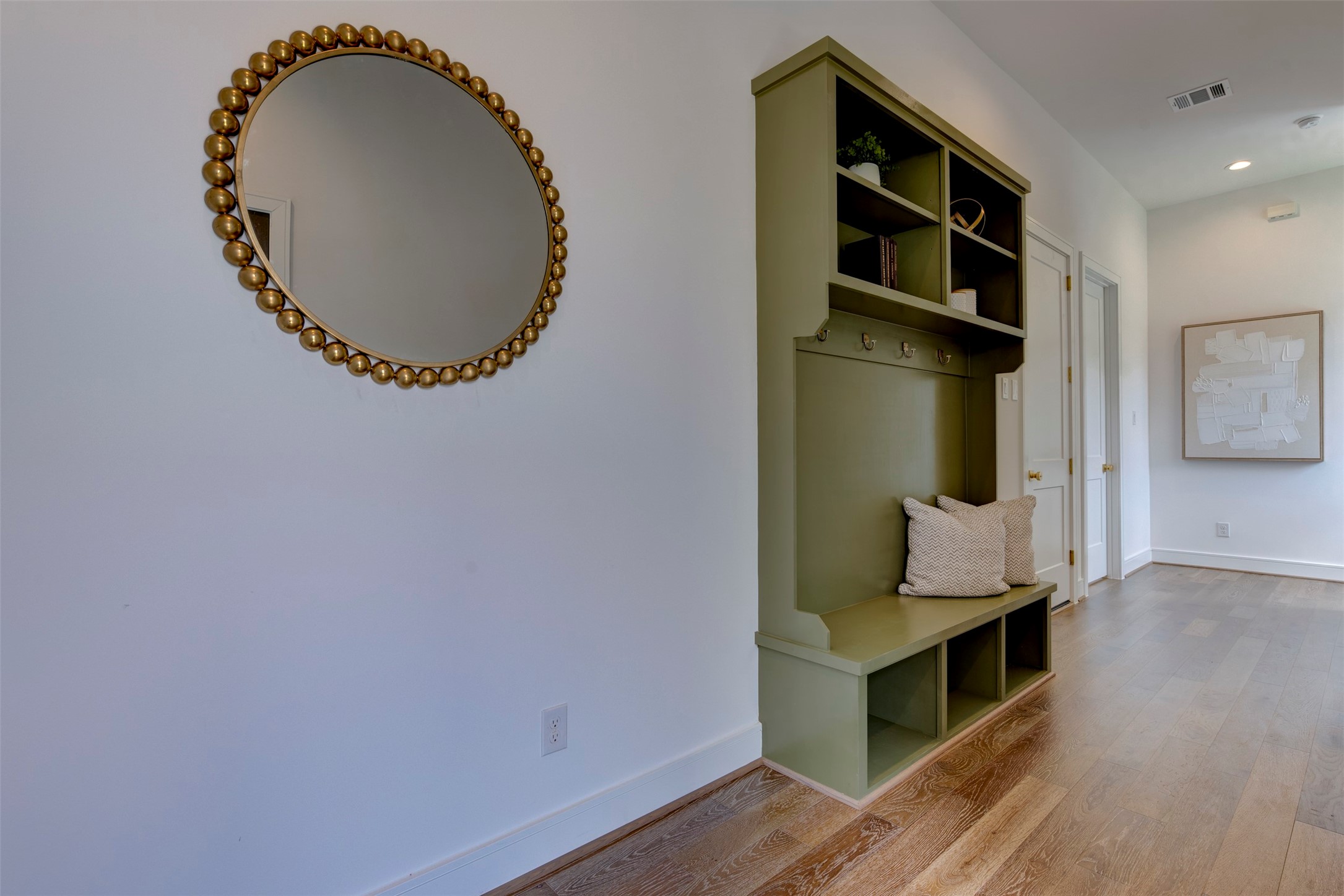 7120 Gary Street, Unit B Houston, TX 77055 - Photo 2 of 29 Beautiful large entryway with ample natural light and elegant built-in décor with hooks and shelves for storing coats, etc.