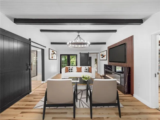 a view of a dining room with furniture window and wooden floor