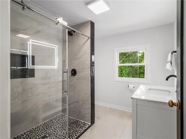 a bathroom with a toilet and a window