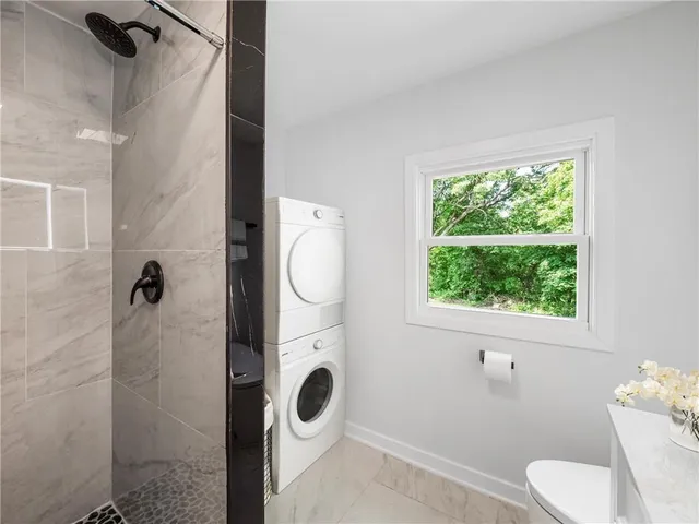 a bathroom with a toilet sink and tub