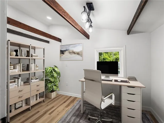 a view of balcony with wooden floor and fence