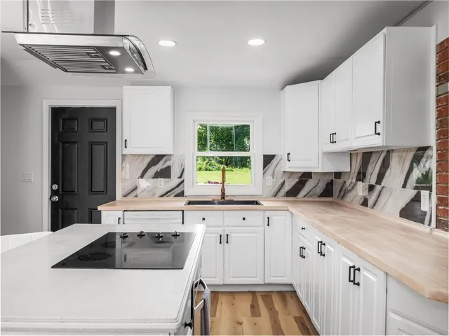 a kitchen with a sink and cabinets