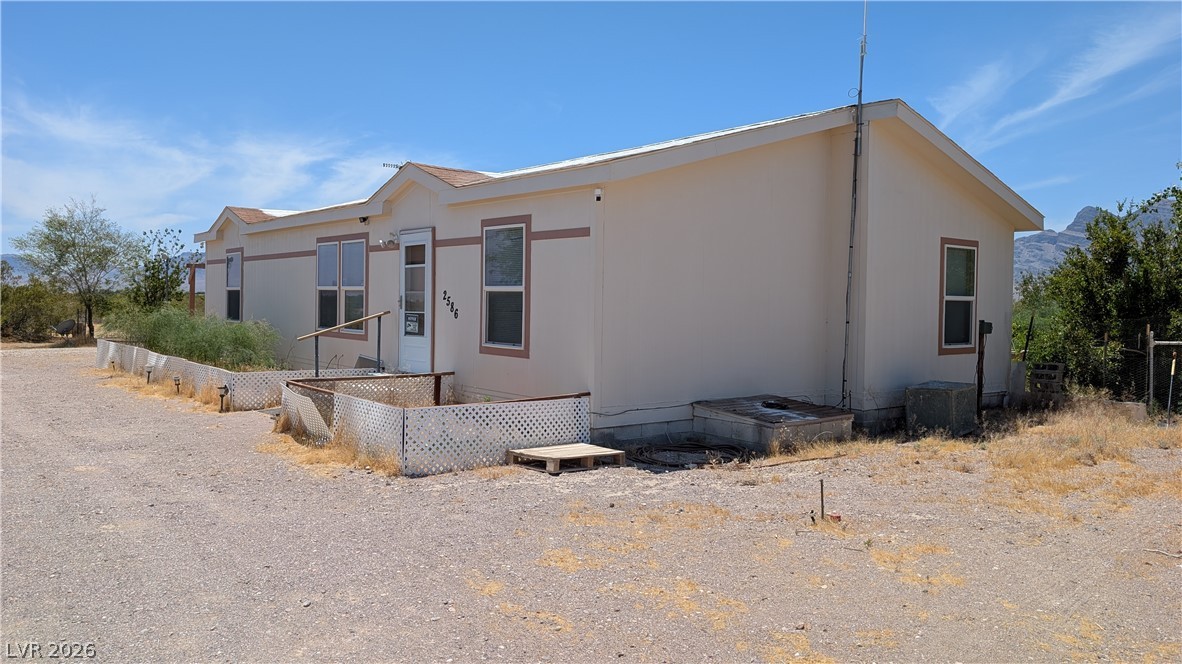 2586 South Miner Road Amargosa Valley, NV 89020 - Photo 5 of 10 A desert oasis awaits with this single-level residence nestled against a mountain backdrop.