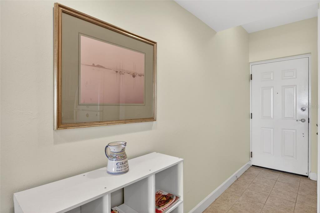 3191 Matecumbe Key Road, Unit 304 Punta Gorda, FL 33955 - Photo 11 of 31 a bathroom with a sink a mirror and vanity