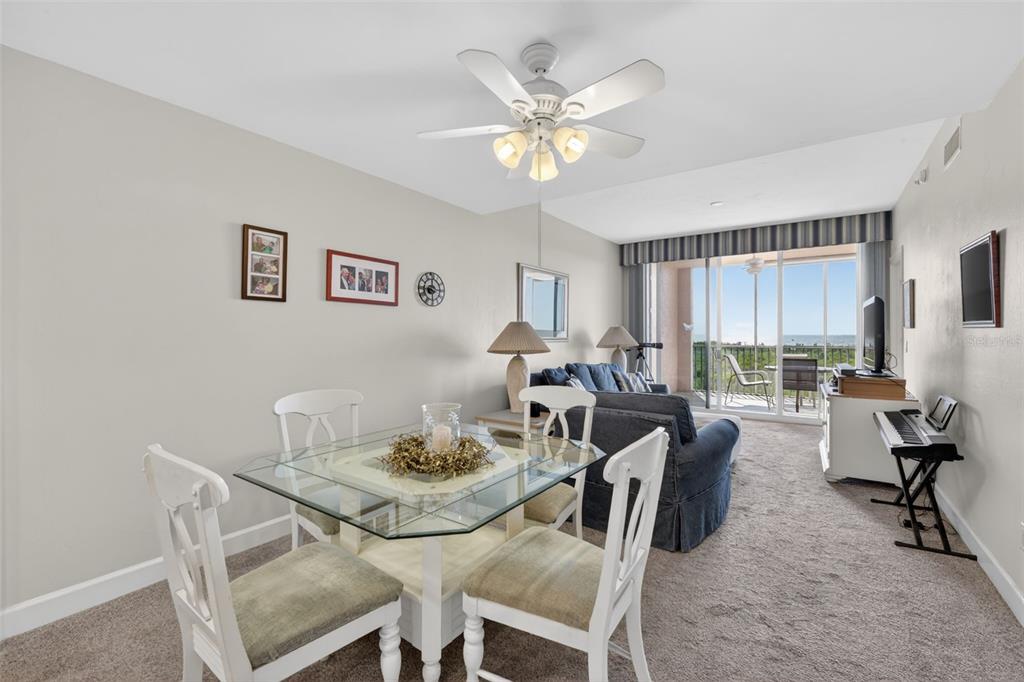 3191 Matecumbe Key Road, Unit 304 Punta Gorda, FL 33955 - Photo 12 of 31 a view of a dining room with furniture window and wooden floor