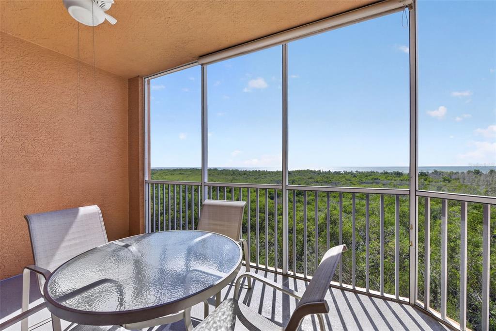 3191 Matecumbe Key Road, Unit 304 Punta Gorda, FL 33955 - Photo 20 of 31 a balcony with table and chairs