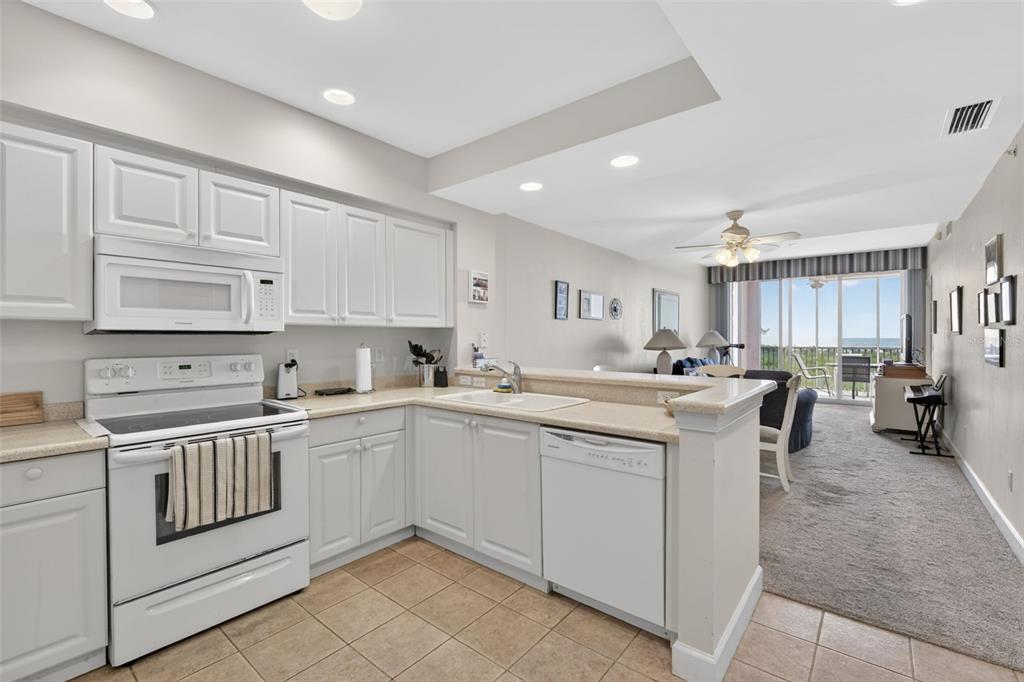 3191 Matecumbe Key Road, Unit 304 Punta Gorda, FL 33955 - Photo 2 of 31 a kitchen with a sink and cabinets