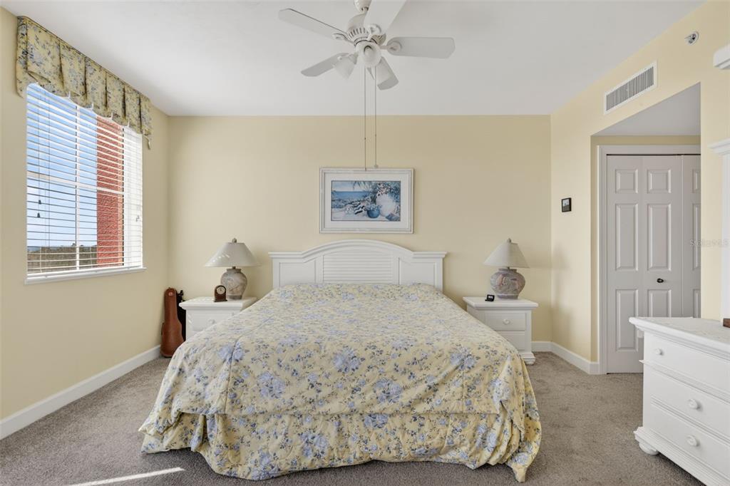 3191 Matecumbe Key Road, Unit 304 Punta Gorda, FL 33955 - Photo 23 of 31 a bedroom with a bed and a chandelier