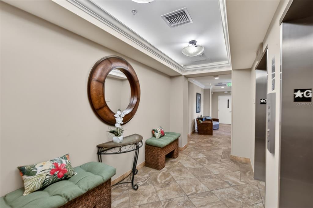 3191 Matecumbe Key Road, Unit 304 Punta Gorda, FL 33955 - Photo 28 of 31 a living room with furniture and a mirror