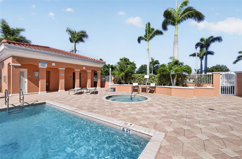 3191 Matecumbe Key Road, Unit 304 Punta Gorda, FL 33955 - Photo 30 of 31 a view of a house with palm trees