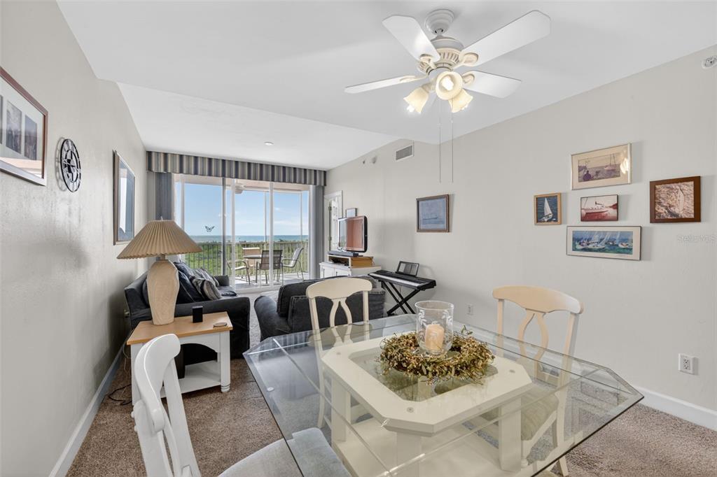 3191 Matecumbe Key Road, Unit 304 Punta Gorda, FL 33955 - Photo 3 of 31 a living room with furniture and a chandelier