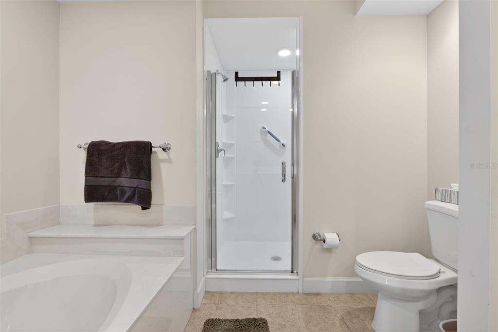 3191 Matecumbe Key Road, Unit 304 Punta Gorda, FL 33955 - Photo 7 of 31 a bathroom with a toilet and a shower