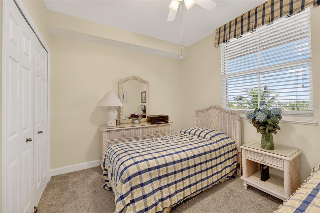 3191 Matecumbe Key Road, Unit 304 Punta Gorda, FL 33955 - Photo 9 of 31 a bedroom with a bed and a potted plant