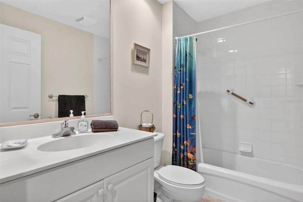 3191 Matecumbe Key Road, Unit 304 Punta Gorda, FL 33955 - Photo 10 of 31 a bathroom with a sink a toilet and shower