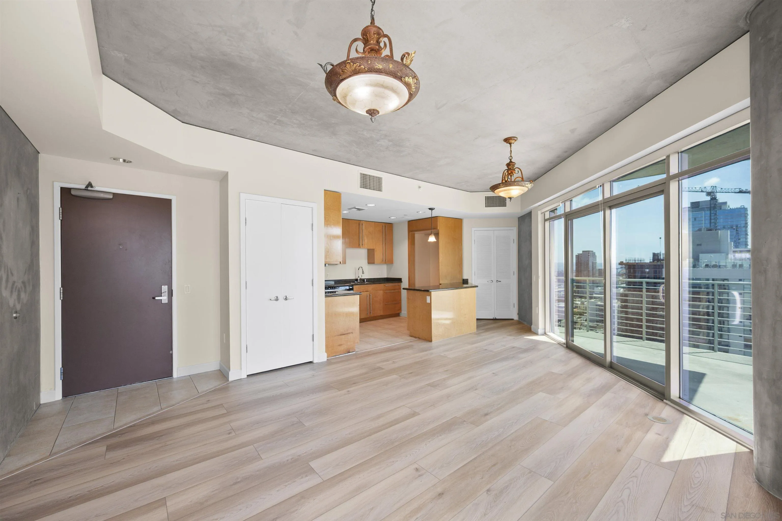 801 Ash Street, Unit 1701 San Diego, CA 92101 - Photo 11 of 44 a view of a kitchen with wooden floor and windows