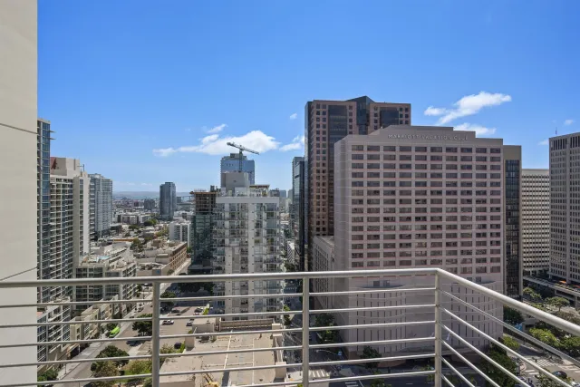 a view of a city from a balcony with city view