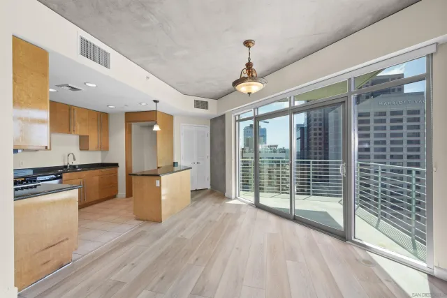 a kitchen with stainless steel appliances granite countertop a stove and a refrigerator