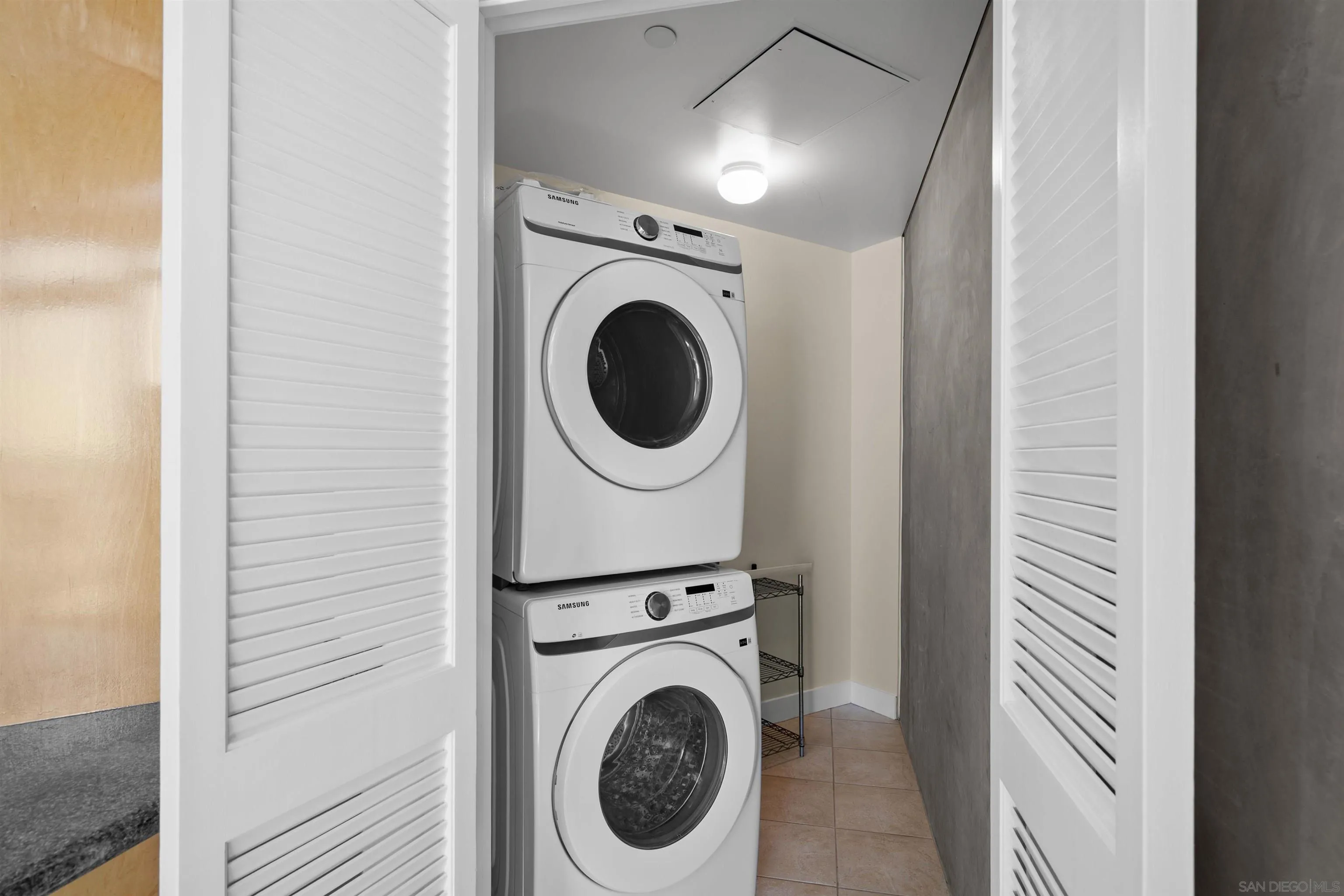 801 Ash Street, Unit 1701 San Diego, CA 92101 - Photo 27 of 44 a view of a hallway with washer and dryer