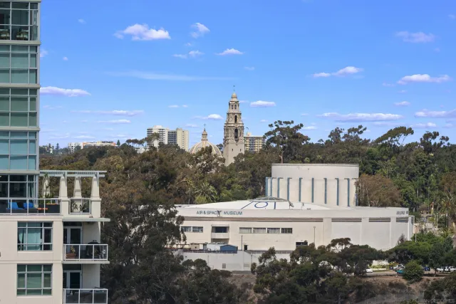 a view of a town with mountains in the background