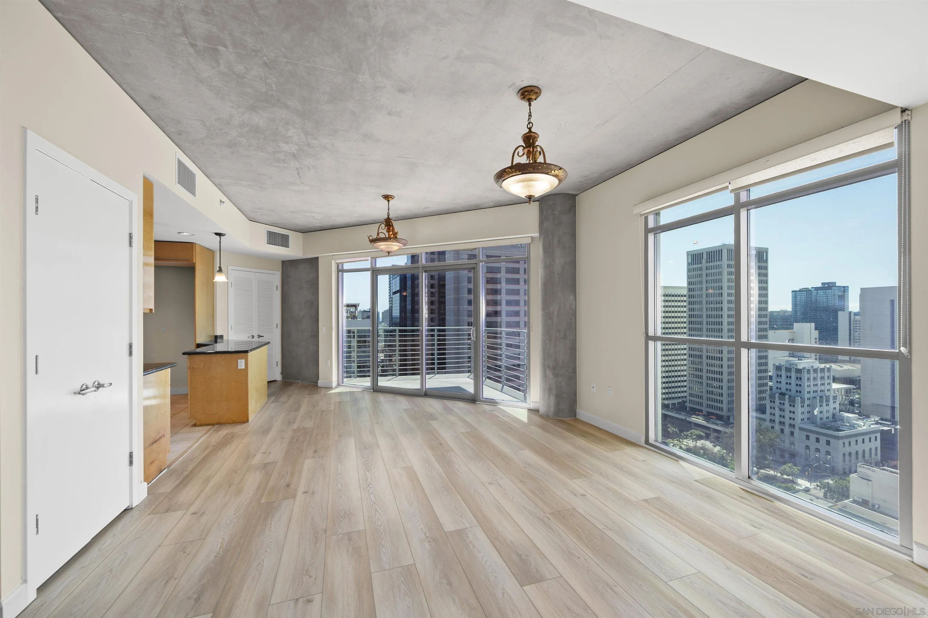 801 Ash Street, Unit 1701 San Diego, CA 92101 - Photo 7 of 44 a view of a room with wooden floor and windows