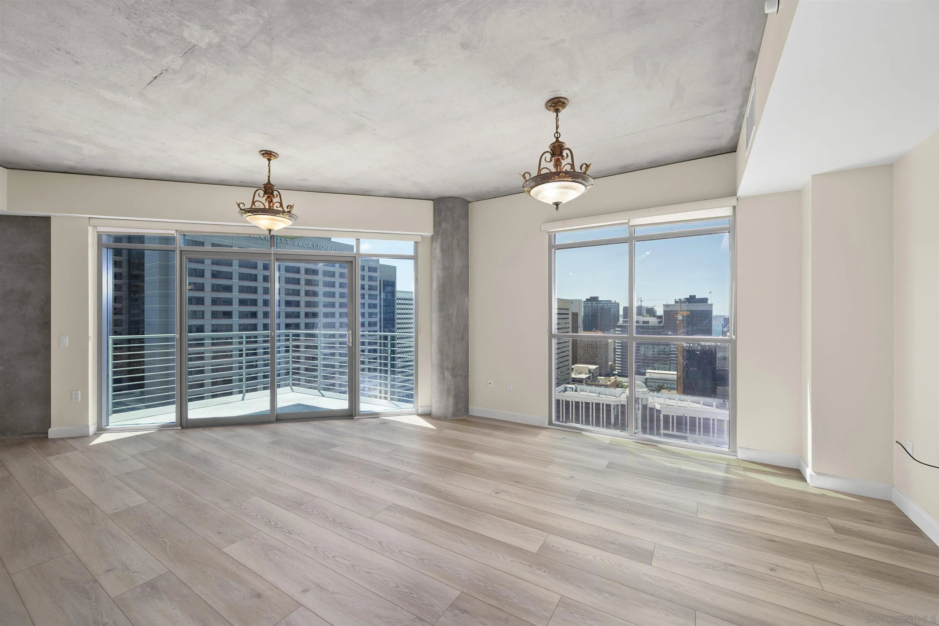 801 Ash Street, Unit 1701 San Diego, CA 92101 - Photo 10 of 44 an empty room with wooden floor and fireplace