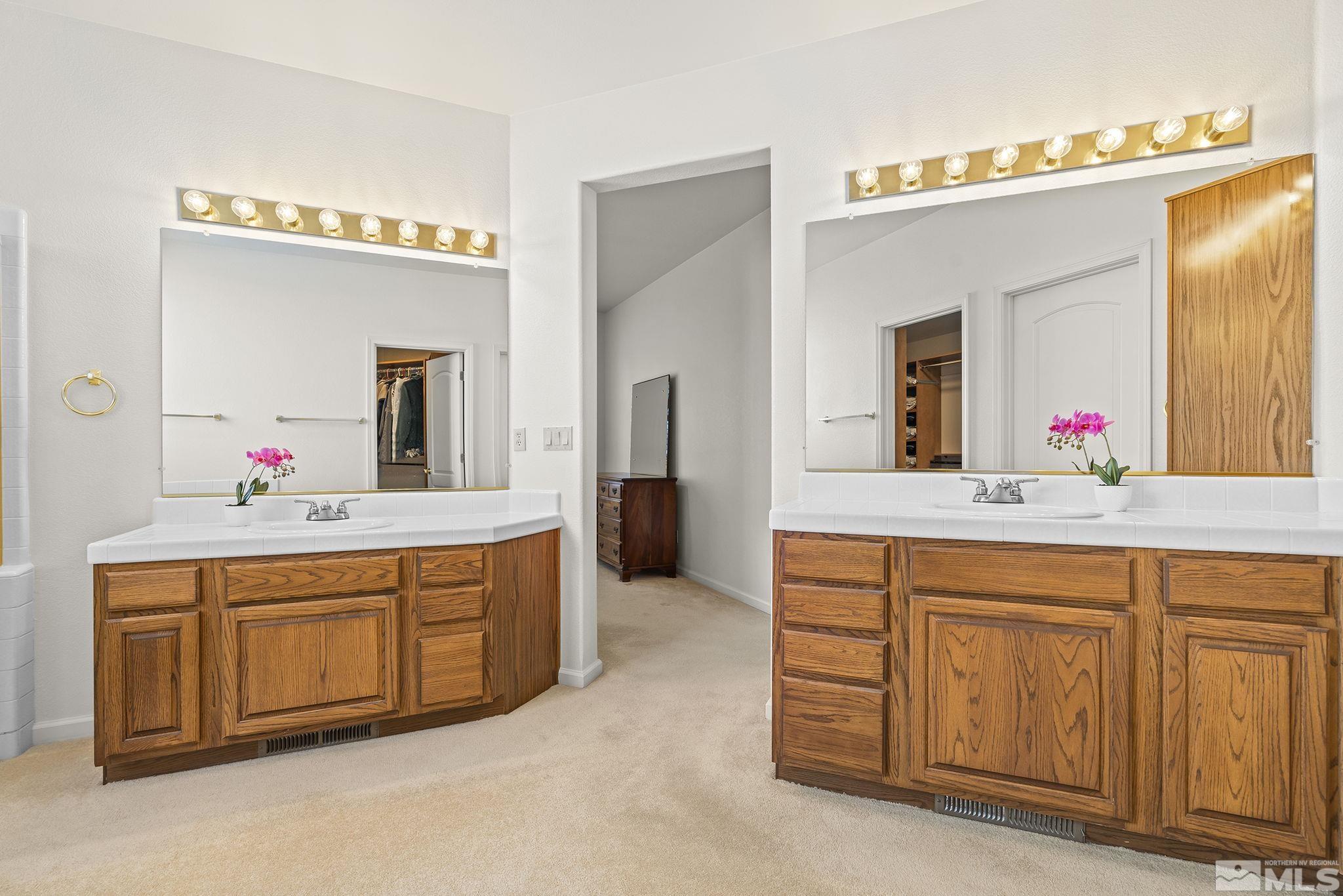 3310 Snake River Drive Reno, NV 89503 - Photo 12 of 33 a spacious bathroom with a sink and a mirror
