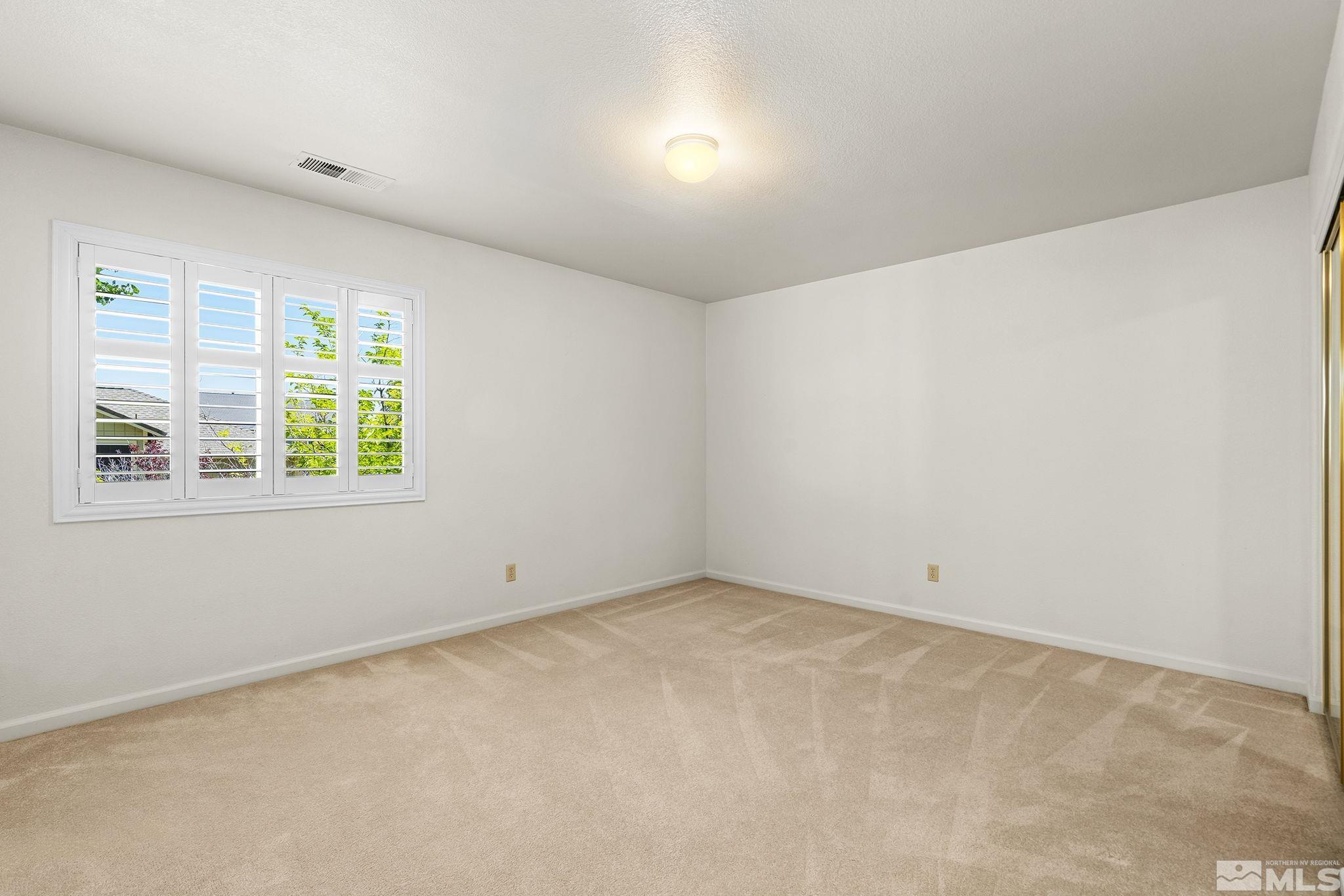 3310 Snake River Drive Reno, NV 89503 - Photo 21 of 33 an empty room with windows