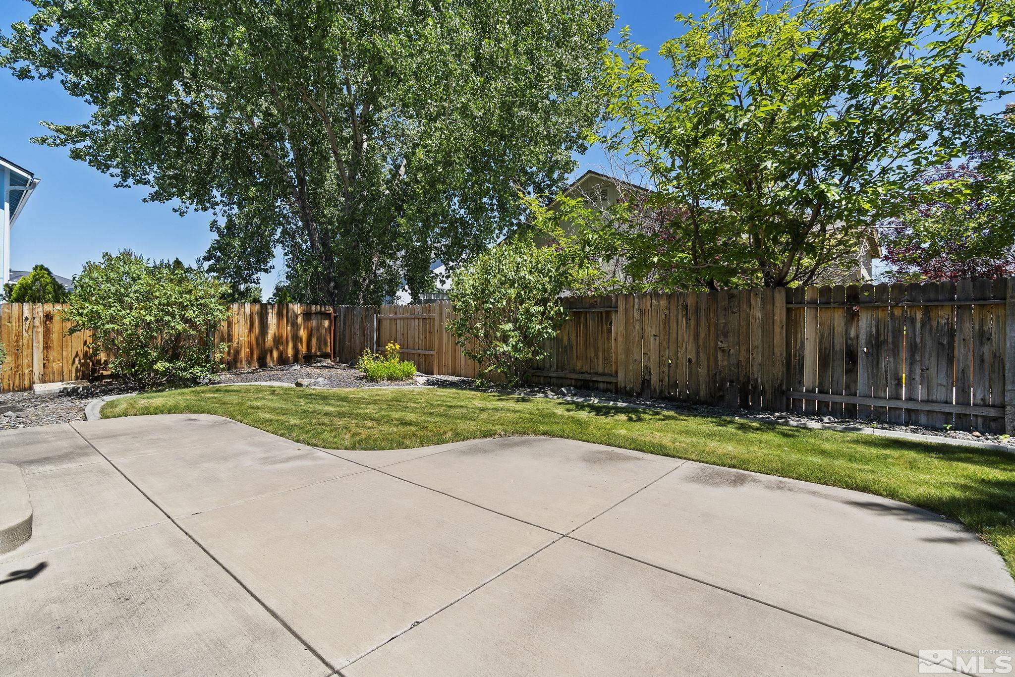 3310 Snake River Drive Reno, NV 89503 - Photo 25 of 33 a view of a park with large trees and a barn in the background