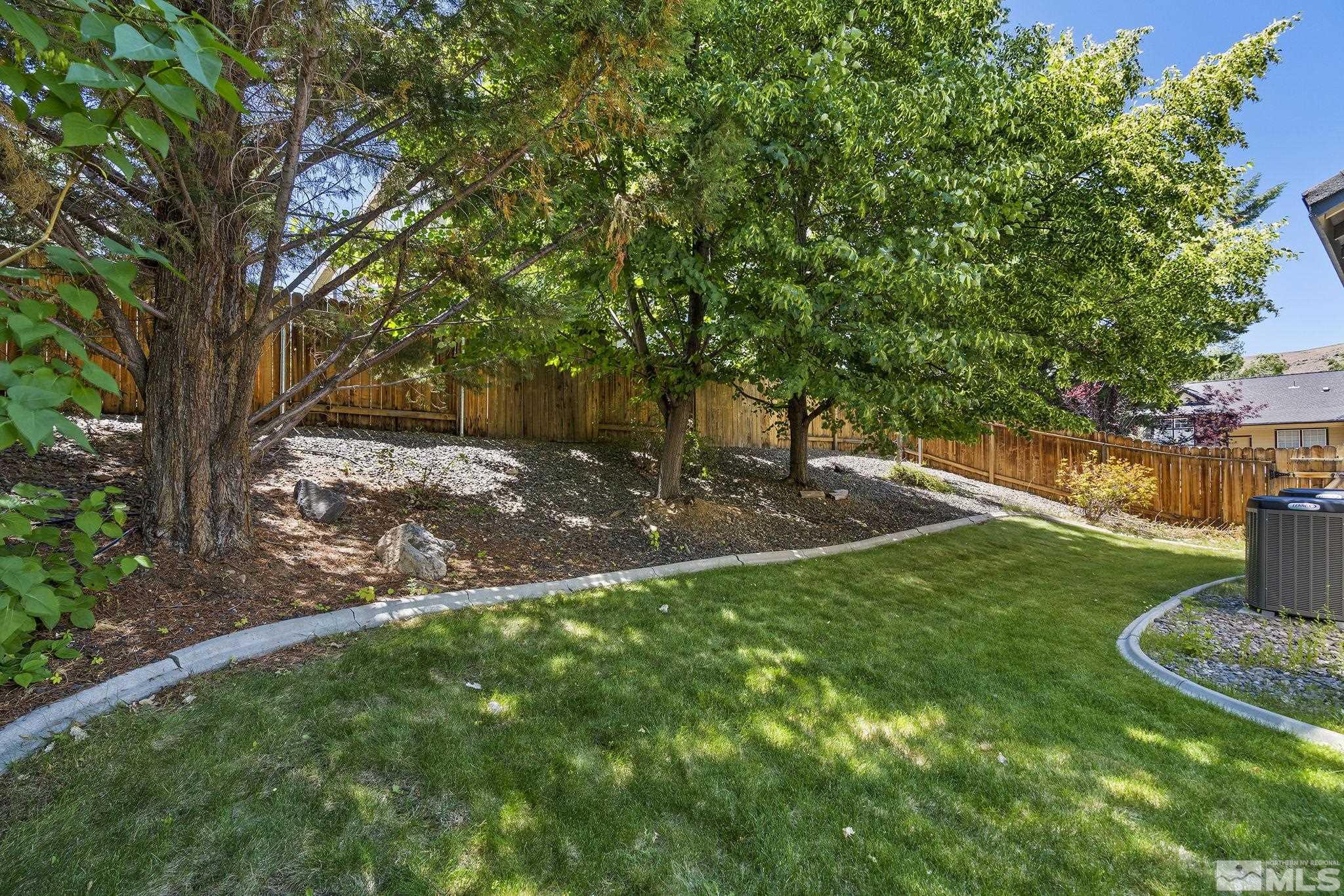 3310 Snake River Drive Reno, NV 89503 - Photo 27 of 33 a view of a backyard with a tree