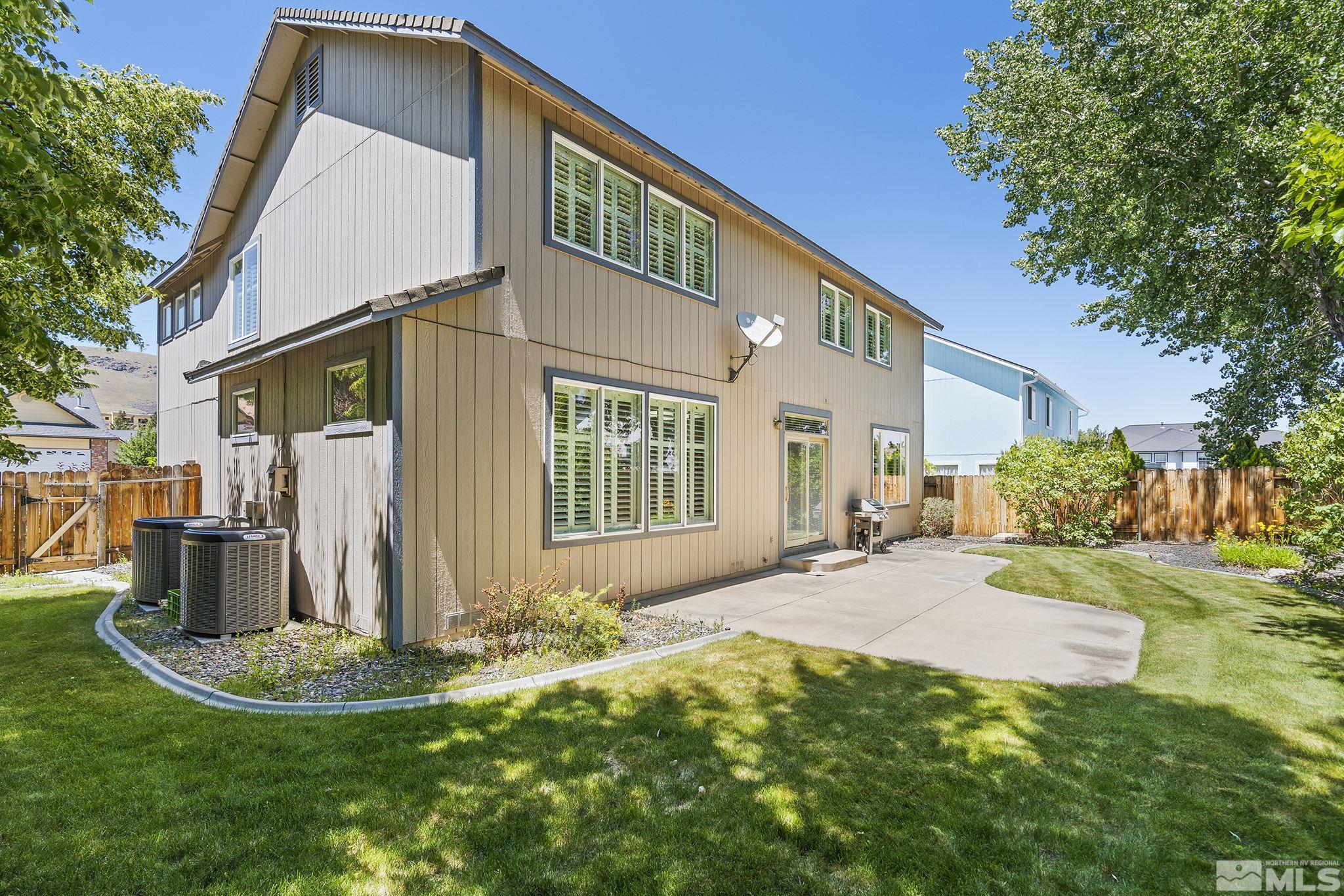 3310 Snake River Drive Reno, NV 89503 - Photo 29 of 33 a front view of a house with a yard