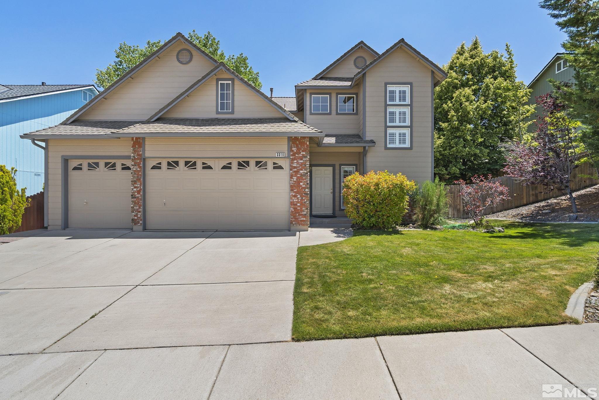 3310 Snake River Drive Reno, NV 89503 - Photo 30 of 33 a view of a house with a yard and garage