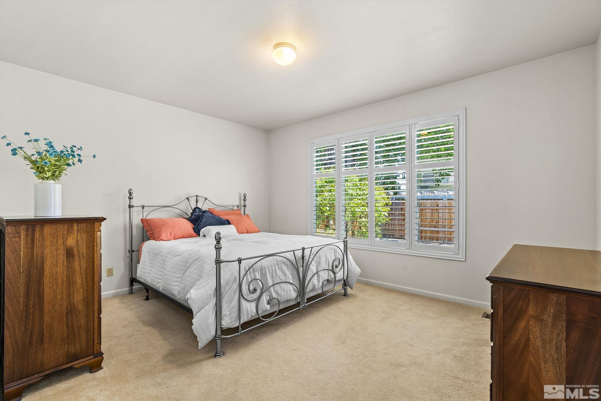 3310 Snake River Drive Reno, NV 89503 - Photo 9 of 33 a bedroom with a bed and a window