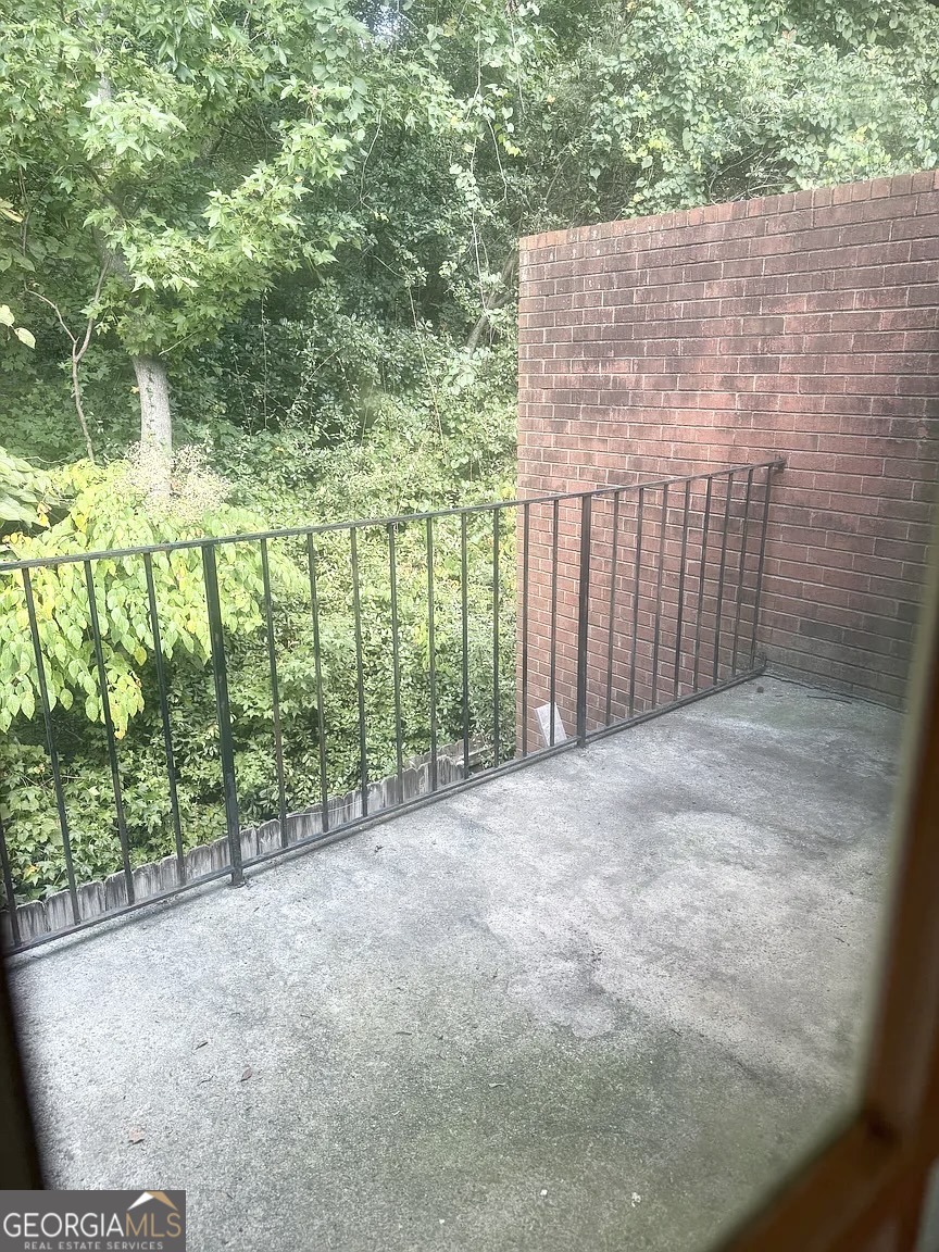 4534 Golf Vista Circle Decatur, GA 30035 - Photo 14 of 17 Private upper-level balcony overlooking trees - perfect for morning coffee or quiet evenings.