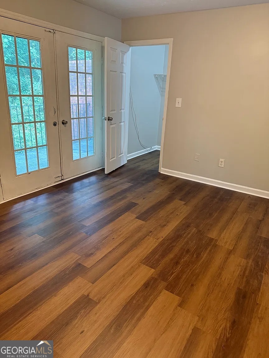 4534 Golf Vista Circle Decatur, GA 30035 - Photo 10 of 17 Spacious primary bedroom featuring a private balcony and large walk-in closet.
