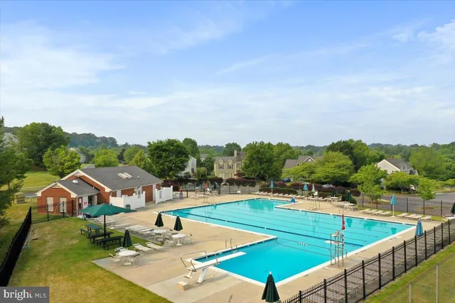 a view of a swimming pool with a patio