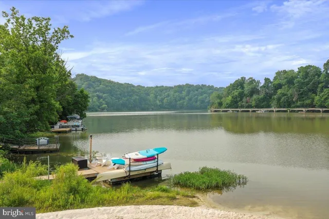 a view of a lake with houses in the back