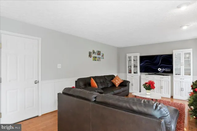 a view of a roof deck with wooden floor and fence